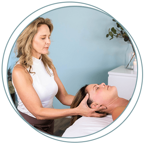 Kathryn Winget massaging a patients head